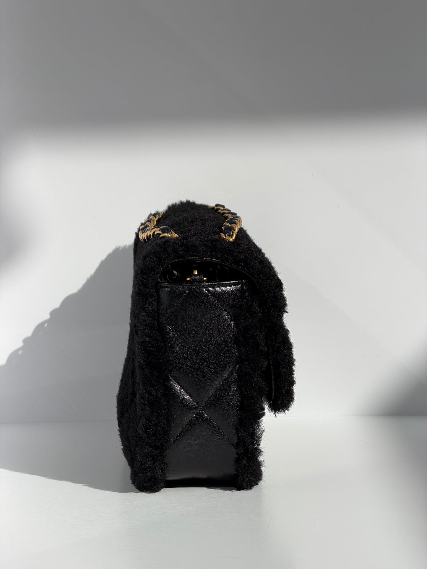Chanel 24K Black Shearling Medium Flap Bag
