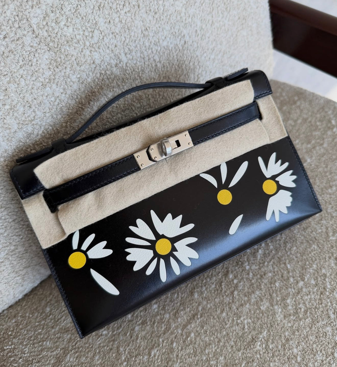 Hermès Kelly Pochette Daisy Black Box Leather White and Jaune Chèvre Inlay Palladium Hardware 2026