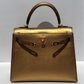 Hermes Limited Edition Bronze Chèvre Metallic Kelly 25 Sellier