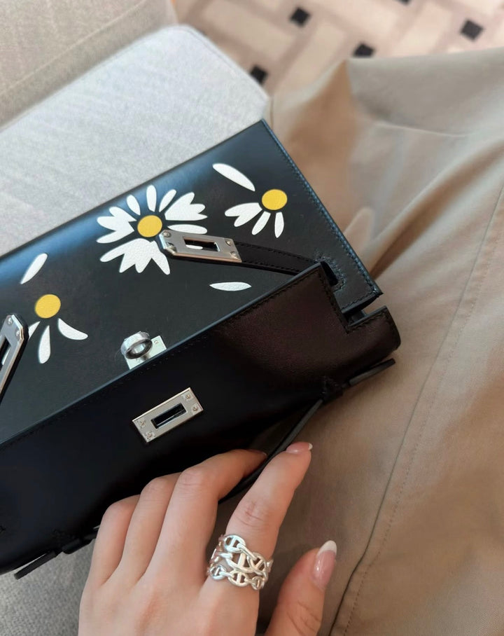 Hermès Kelly Pochette Daisy Black Box Leather White and Jaune Chèvre Inlay Palladium Hardware 2026