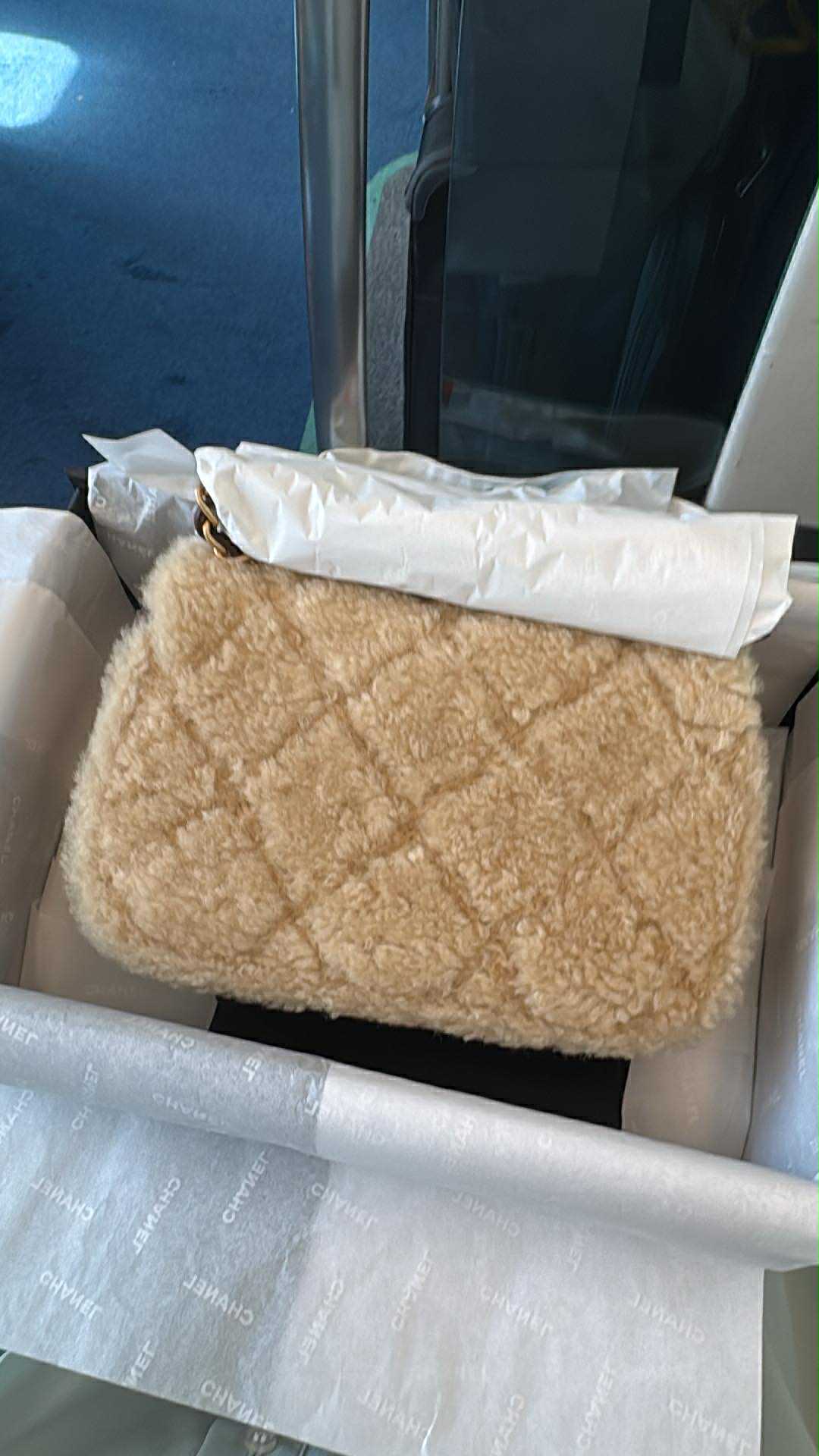 Chanel 25K Brown Mini Shearling Flap Bag