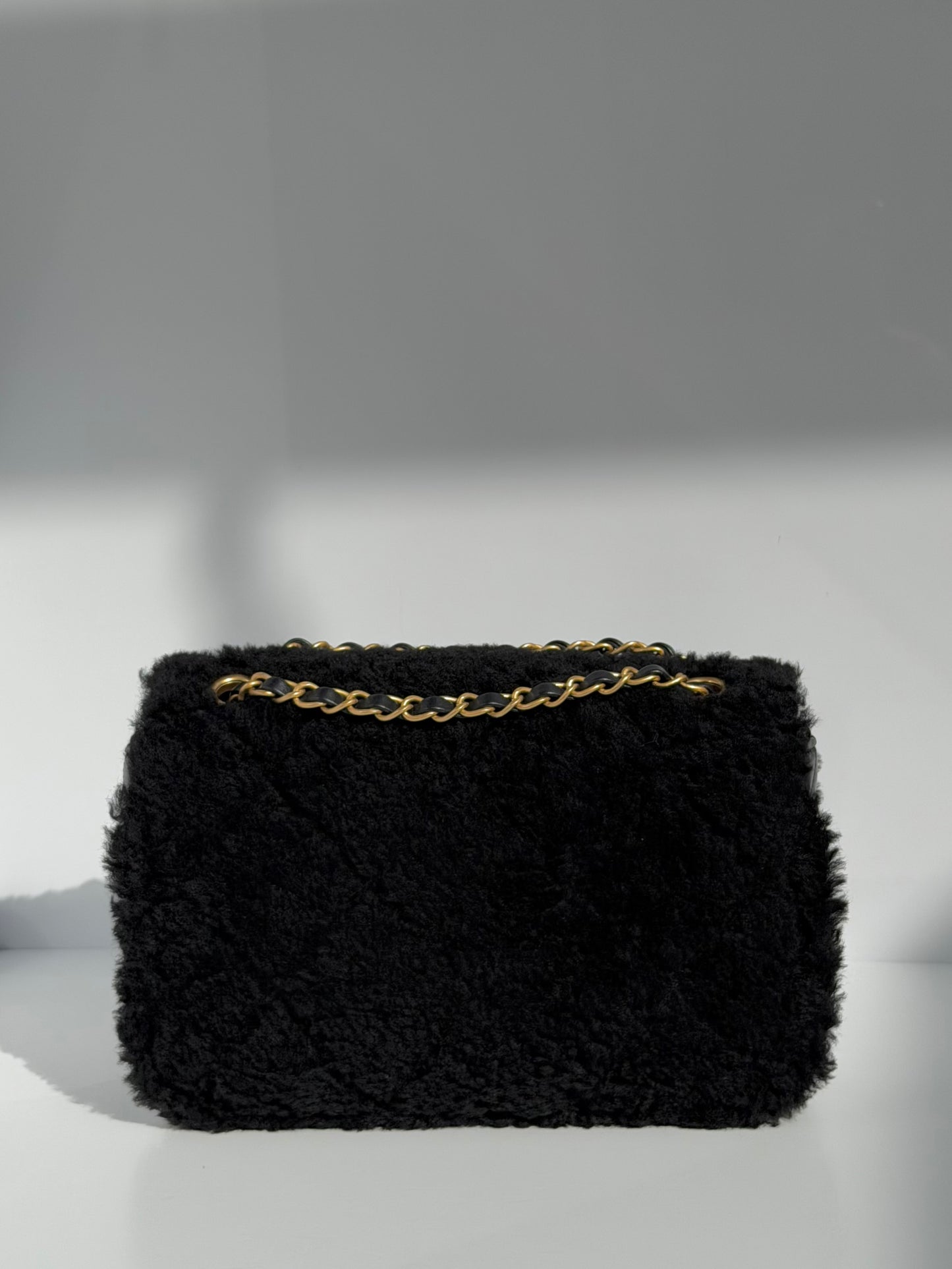 Chanel 24K Black Shearling Medium Flap Bag