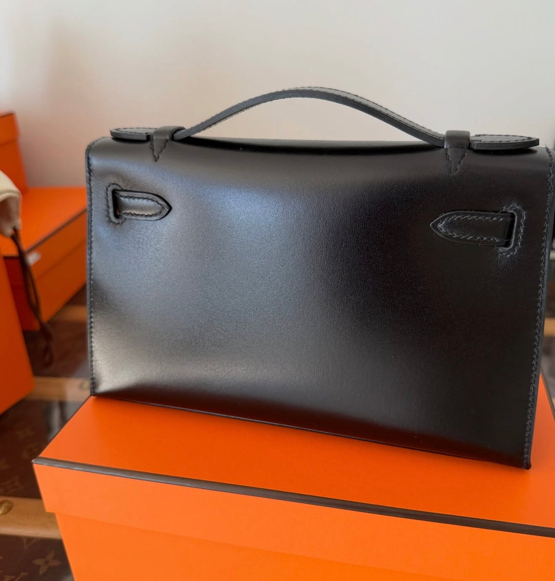 Hermès Kelly Pochette Daisy Black Box Leather White and Jaune Chèvre Inlay Palladium Hardware 2026
