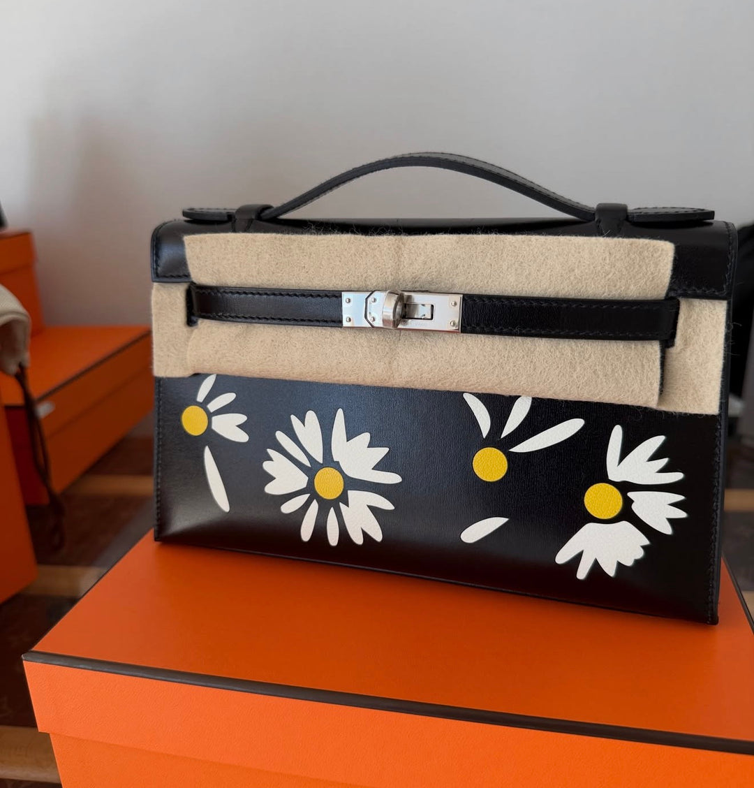 Hermès Kelly Pochette Daisy Black Box Leather White and Jaune Chèvre Inlay Palladium Hardware 2026