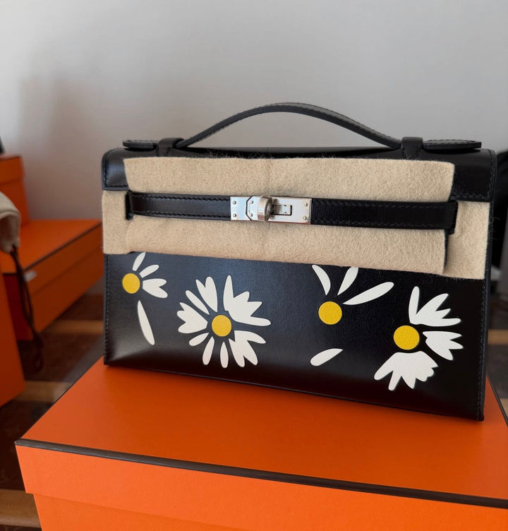 Hermès Kelly Pochette Daisy Black Box Leather White and Jaune Chèvre Inlay Palladium Hardware 2026