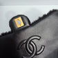Chanel 24K Black Shearling Medium Flap Bag
